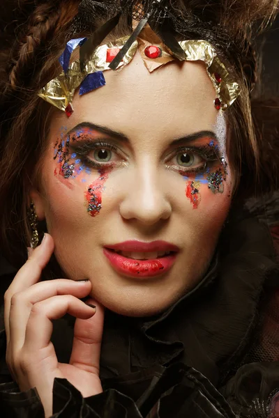 Portrait of woman with artistic make-up in blue smoke — Stock Photo, Image