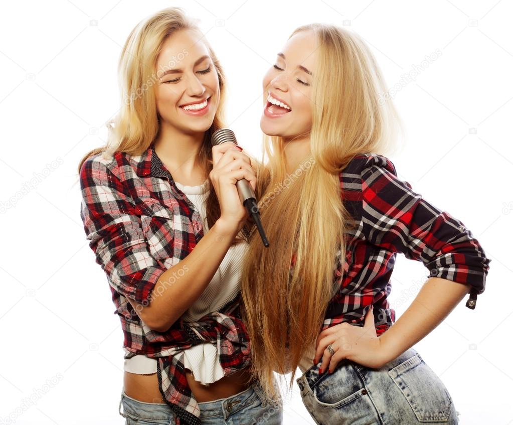 two young hipster girls singing