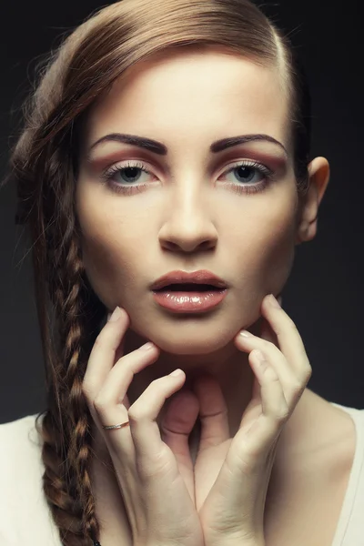 Portrait of beautiful young blonde woman with creative braids ha — Stock Photo, Image