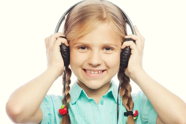 Beautiful happy little girl with headphones — Stock Photo, Image