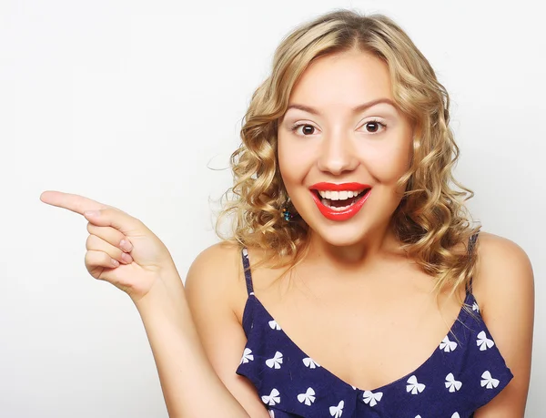 Young woman with her finger up — Stock Photo, Image