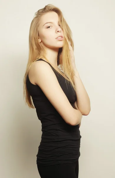 Beautiful woman with long blond hair. Fashion model posing at st — Stock Photo, Image