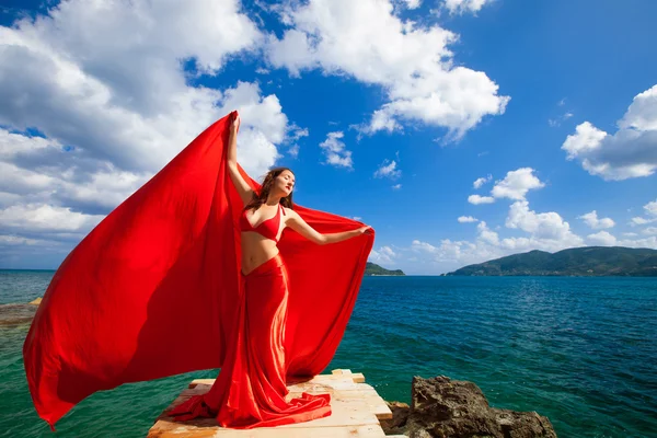 Woman with red skirt and  fabric — Stock Photo, Image