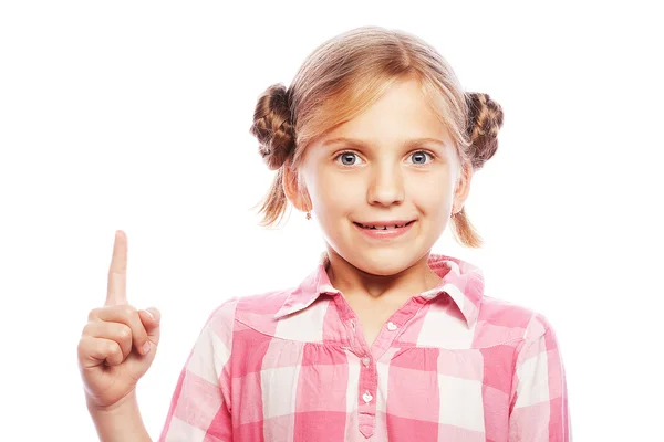 Mooie school meisje haar wijsvinger naar boven wijzen in exciteme — Stockfoto