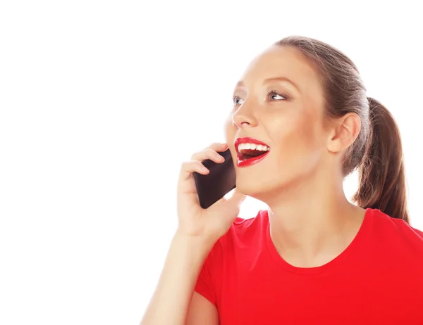 Kvinna med en mobiltelefon isolerad på en vit bakgrund — Stockfoto