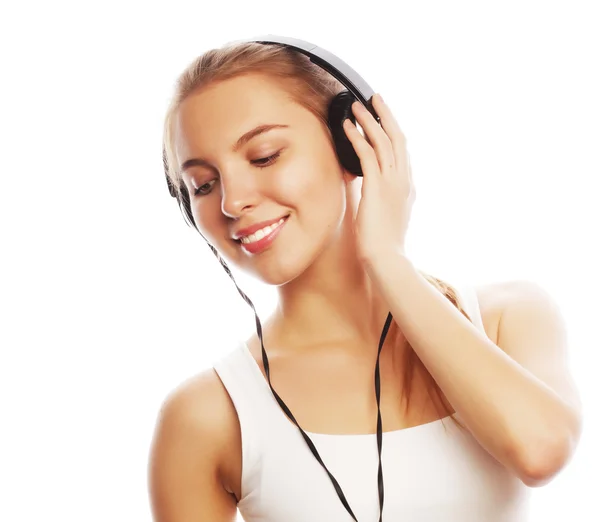 Žena s sluchátka, poslech hudby. Hudební dospívající dívka izolovaných na květi — Stock fotografie