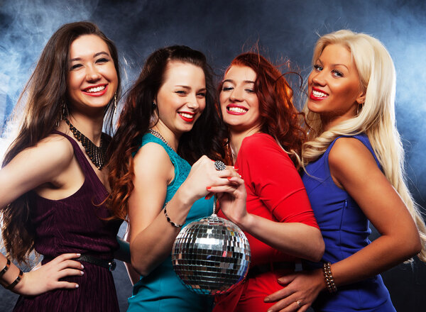 Group of partying girls  with disco ball