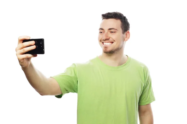 Young man making photo of himself — Stock Photo, Image