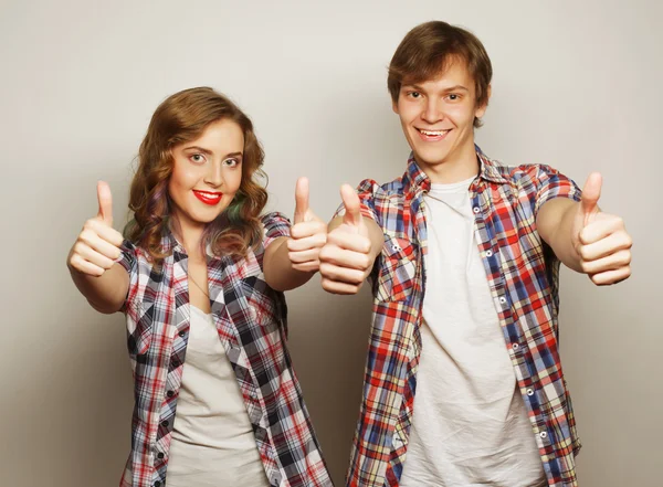 Lovely couple with thumbs-up gesture — Stock Photo, Image