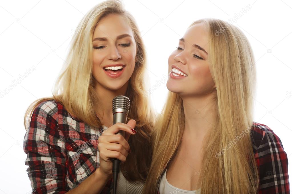 two young hipster girls singing