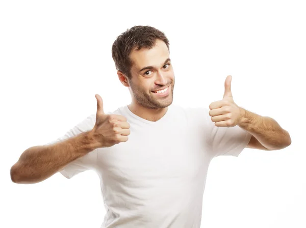 Happy handsome man showing thumbs up — Stock Photo, Image