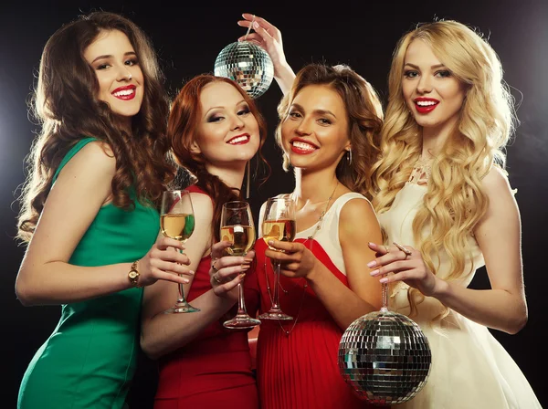 Party  girls clinking flutes with sparkling wine — Stock Photo, Image