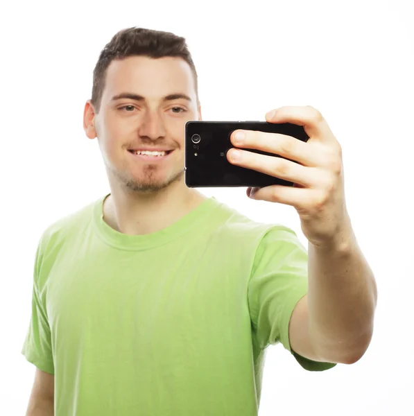 Young man making photo of himself — Stock Photo, Image