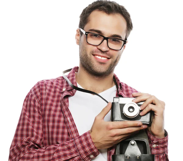 Young man with a retro camera — Stock Photo, Image