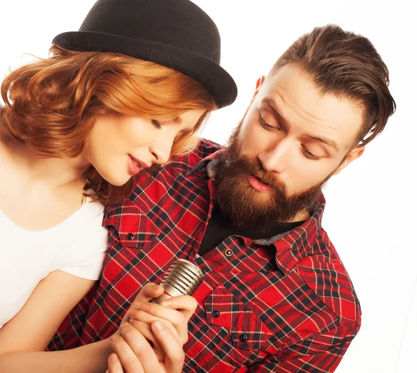 Lovely couple with microphone — Stock Photo, Image