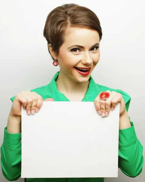 Young casual woman happy holding blank sign — Stock Photo, Image