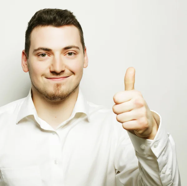 Hombre de negocios va pulgares hacia arriba — Foto de Stock