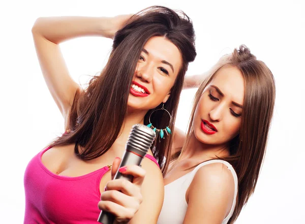 Sensual girls singing with microphone — Stock Photo, Image