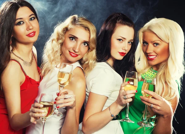 Girls clinking flutes with sparkling wine — Stock Photo, Image