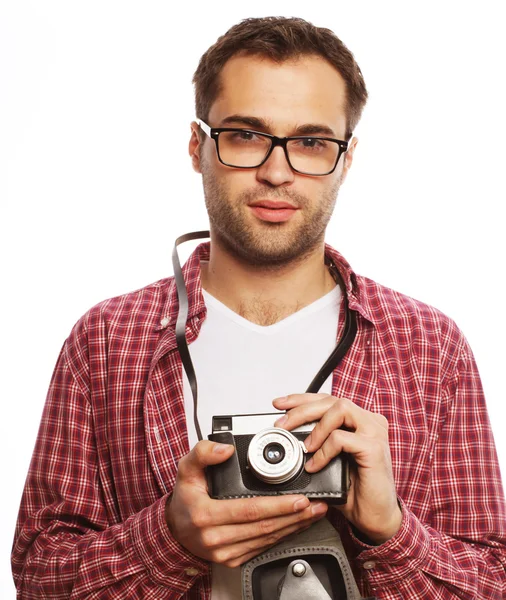 Young man with a retro camera — Stock Photo, Image