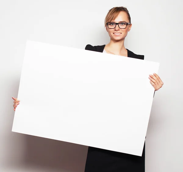 Business woman holding a blank billboard. Royalty Free Stock Photos