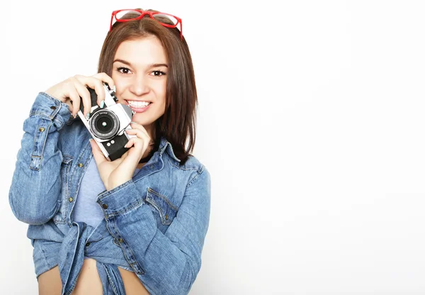 Young pretty woman holding camera — Stock Photo, Image