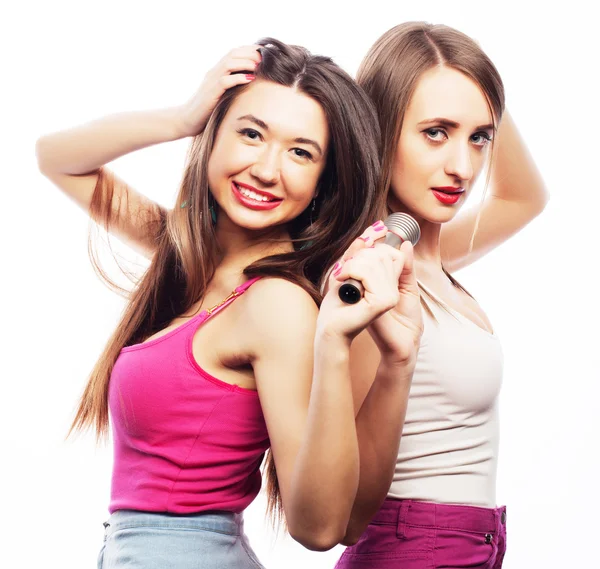 Sensual girls singing with microphone — Stock Photo, Image