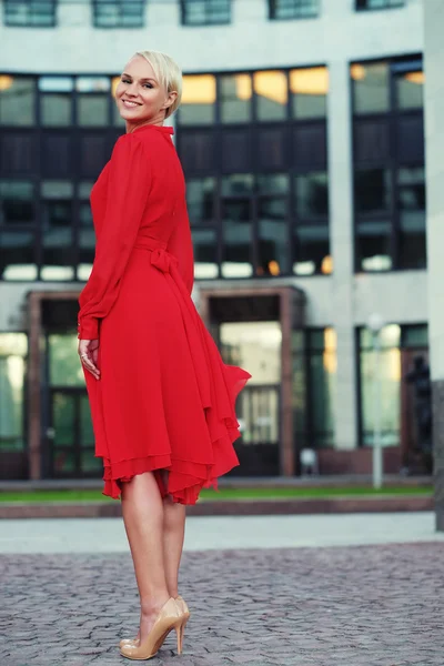 Happy beautiful woman in red summer dress — Stock Photo, Image