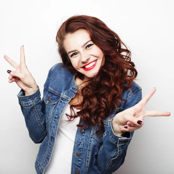 Lovely woman showing victory or peace sign — Stock Photo, Image