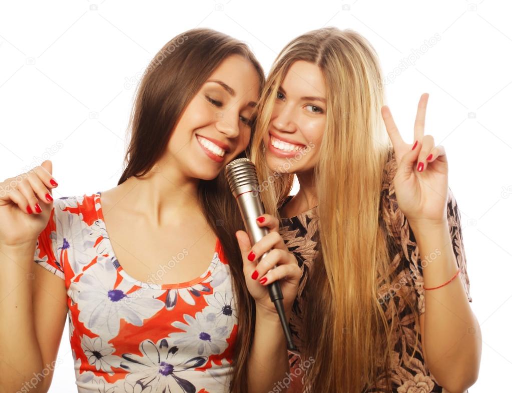 two young girls singing
