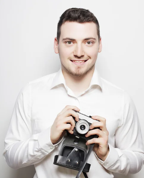 Jonge fotograaf over witte achtergrond — Stockfoto
