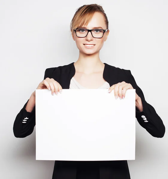 Business woman holding a blank billboard. — Stock Photo, Image