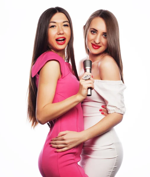 Sensual girls singing with microphone — Stock Photo, Image