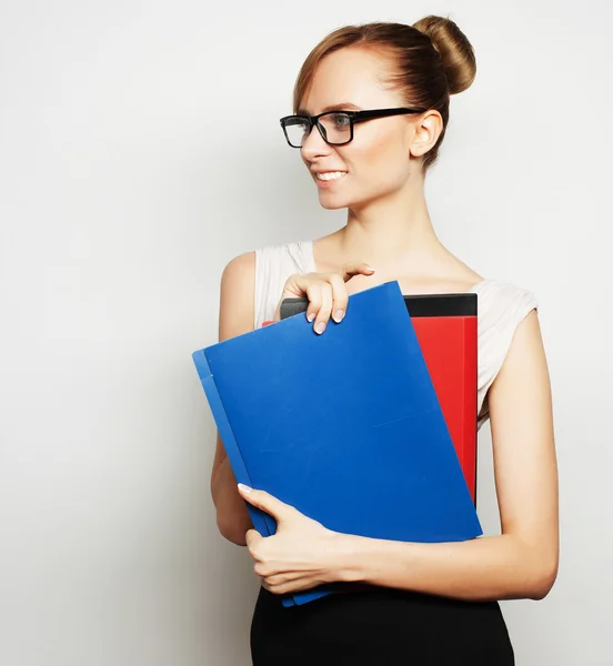 Young businesswoman holding folders — Stock Photo, Image