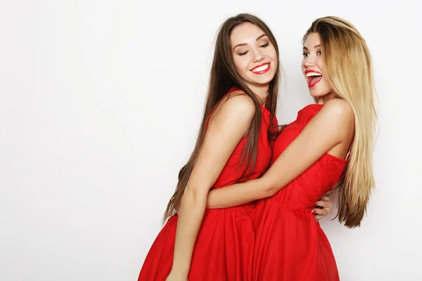 Foto van een charmante jonge meisjes in rode jurk — Stockfoto