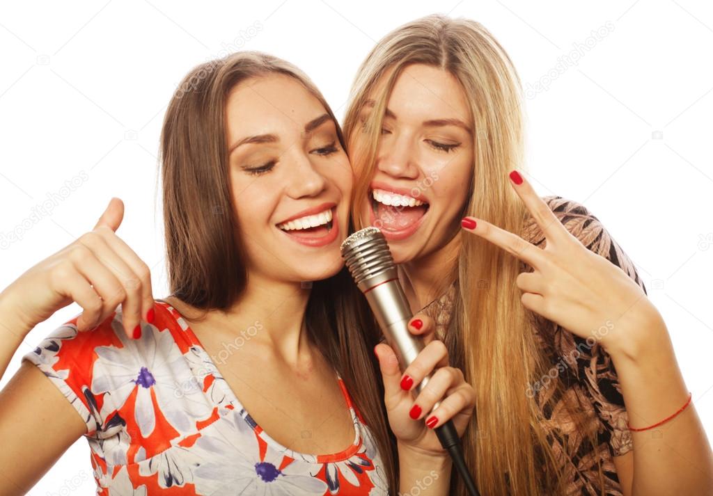 two young girls singing