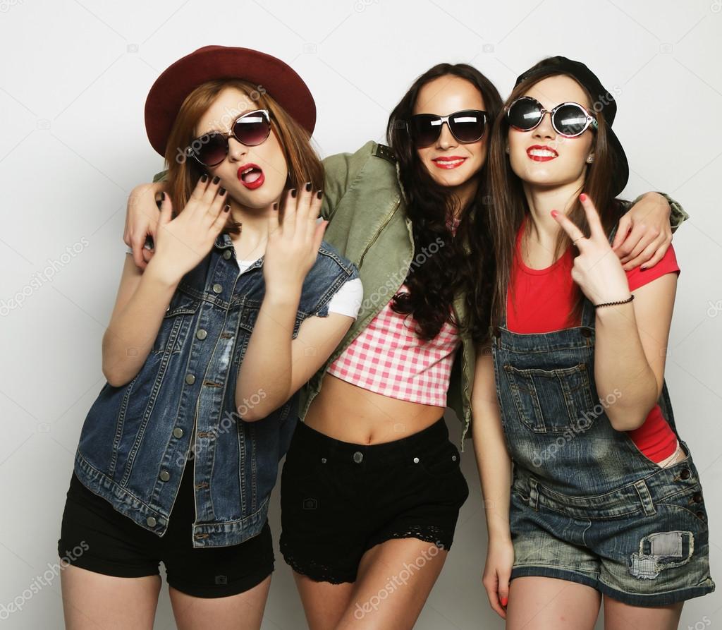 Three stylish sexy hipster girls best friends.