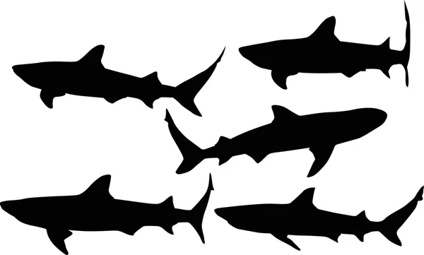 Silhouettes de requins noirs — Image vectorielle