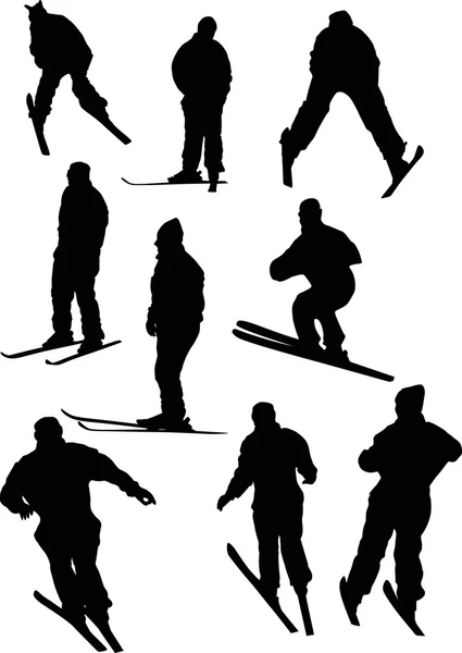 Schwarze Skifahrer-Silhouetten — Stockvektor