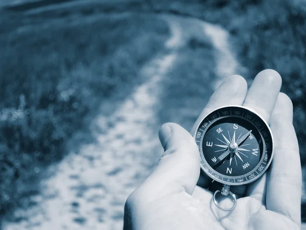 Compass in man hand — Stock Photo, Image