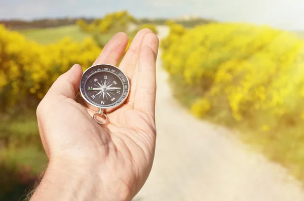 Compass in mans hand — Stock Photo, Image