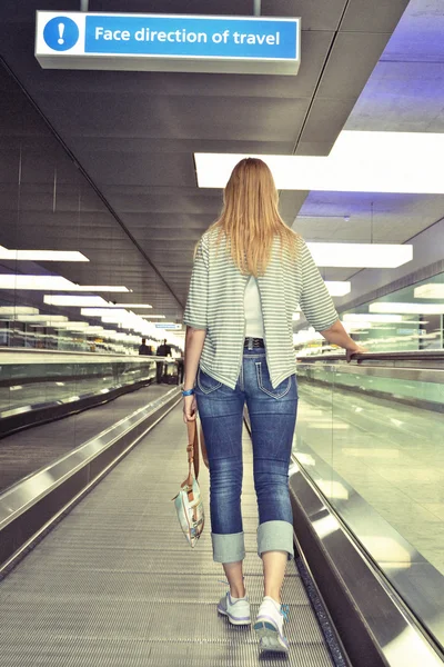 Girl on the speedwalk — Stock Photo, Image