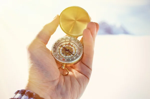 Compass in  hand in winter — Stock Photo, Image