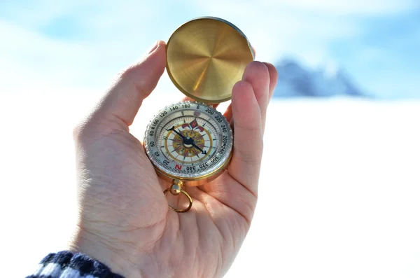 Compass in  hand in winter — Stock Photo, Image