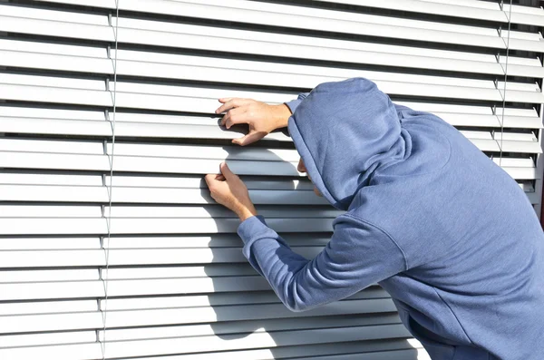 Thief man at the window — Stock Photo, Image