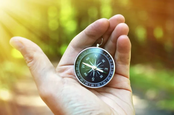 Compass  in male  hand — Stock Photo, Image