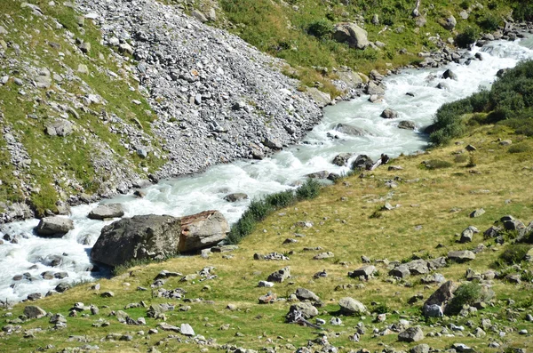 Mountain river coming from Trift glacier. — Stock Photo, Image