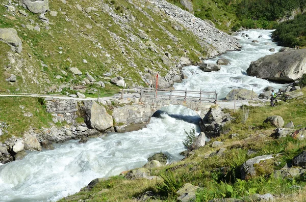 Mountain river coming from Trift glacier. — Stock Photo, Image