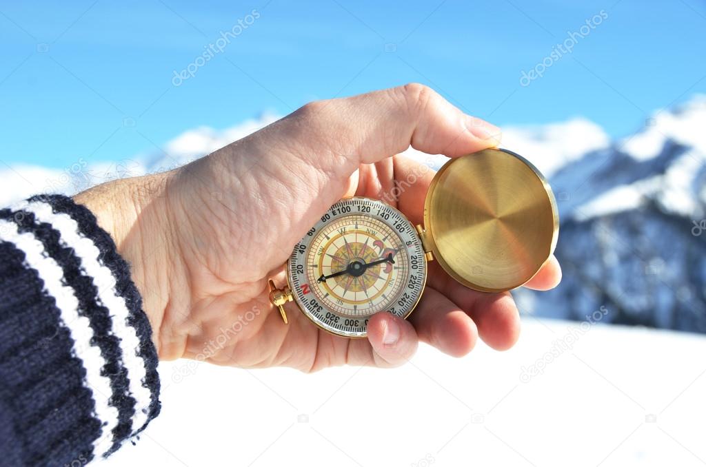 Compass in  hand in winter