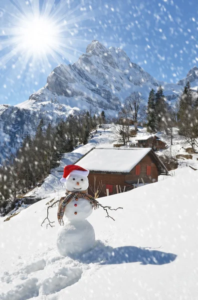 Cute snowman in Swiss Alps — Stock Photo, Image